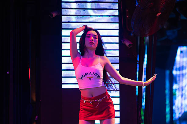 16 March 2025, Ho Chi Minh City - Vietnam.Young women perform dances on Bùi Viện Street, a place famous for its vibrant nightlife and popularity with tourists. The scene showcases the street’s energetic atmosphere and the role of performance in the city’s social and cultural life.