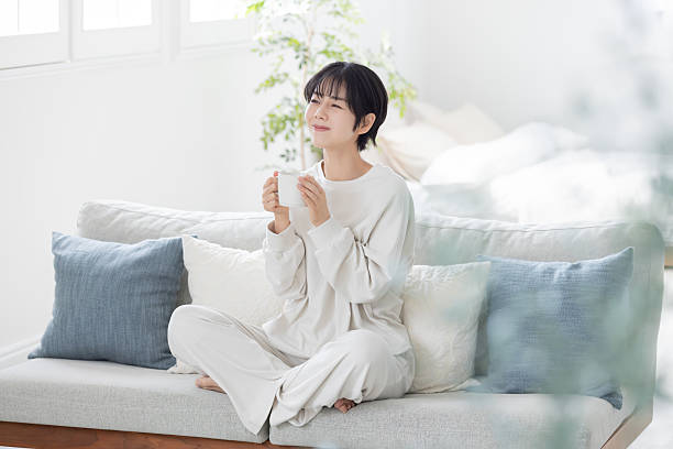 istock Asian woman drinking coffee to wake up 2244425222