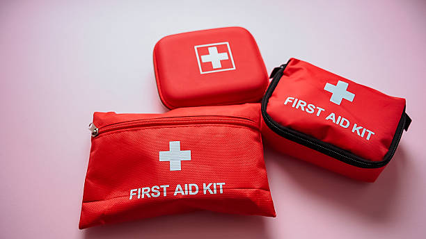 istock Three conspicuously arranged red first aid kits, clearly marked with white crosses, are prominently displayed for swift access and immediate readiness in case of emergencies that may arise 2244425674