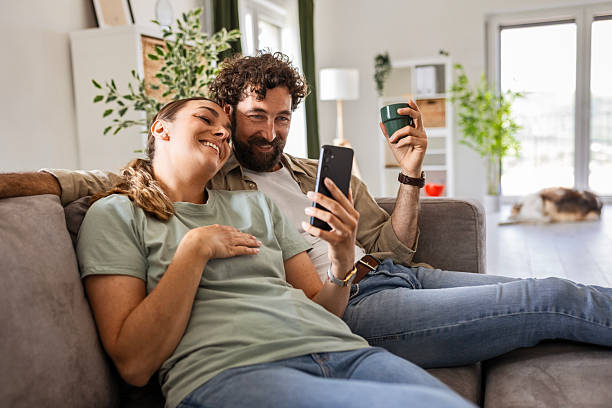 istock Smiling Man and Woman Having Video Chat Indoors 2244427152