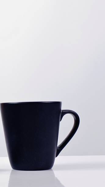 istock Minimalist dark blue coffee cup on a white background 2244428525