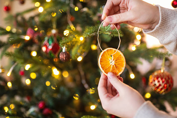 istock Woman decorating Christmas tree 2244428752