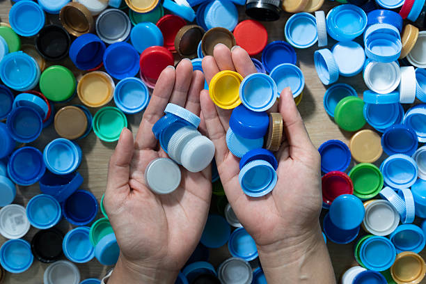 istock Close up hand holding plastic bottles for recycling to conserve 2244429818