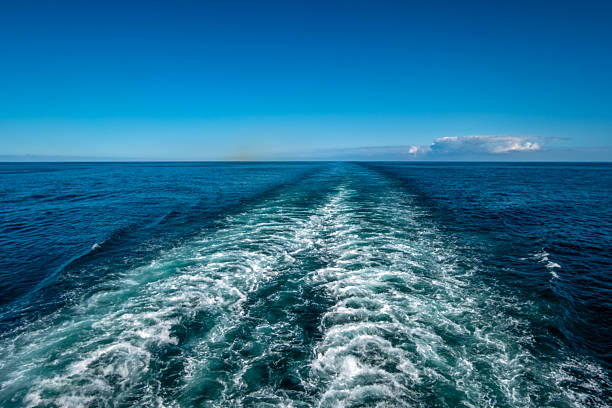 Ocean wake from cruise ship on a bright summers day.