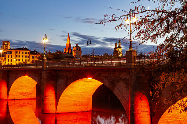 istock Stone bridge over the Ebro river at dusk 2244437712