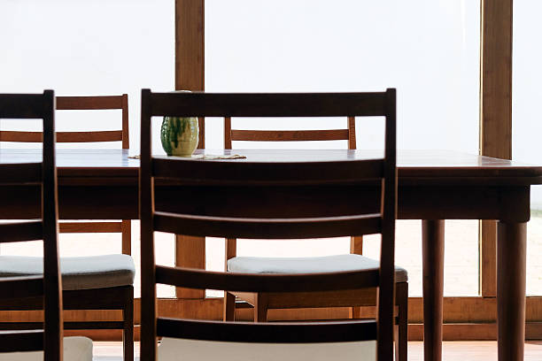 istock Wooden table and chairs in a dining room 2244437952