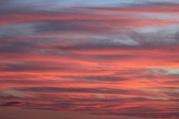 istock Fiery Horizon A Sky Ablaze with Sunset Hues. Pink and Blue Clouds 2244438931