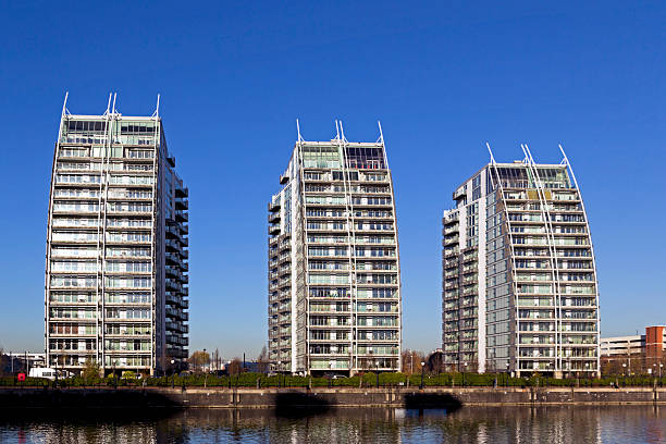 View across the canal to modern apartments at Salford Quays, Manchester, UK