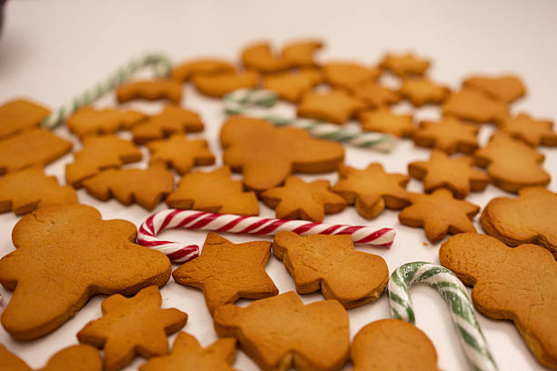 istock Gingerbread Cookies and Candy Canes Ready for Christmas Celebration in a Cozy Kitchen Setting 2244439184