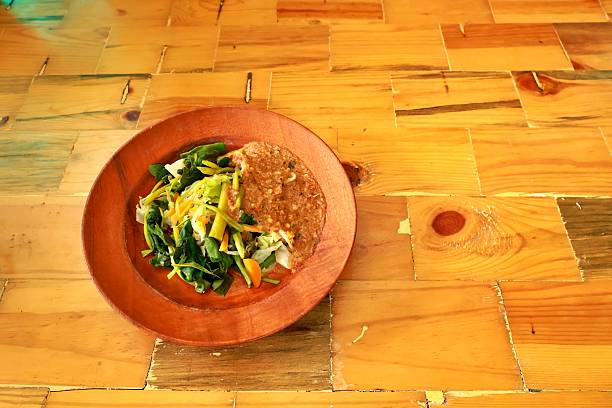 Pecel is made from steamed vegetables as a flavoring and served with peanut sauce.