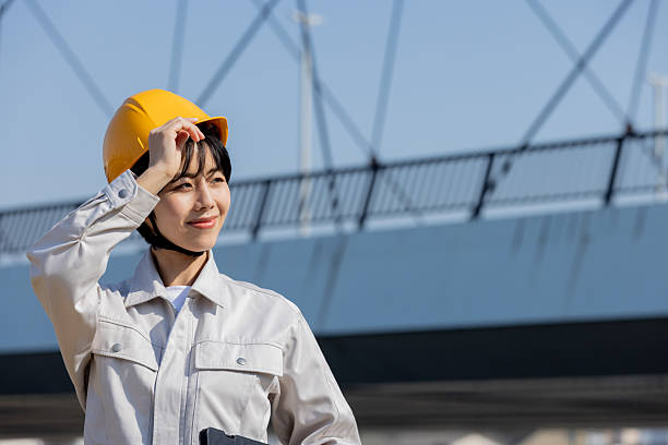 istock Asian female engineer in work clothes 2244442046