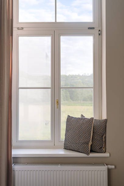 istock Cozy windowsill with decorative cushions for a serene living space 2244444794