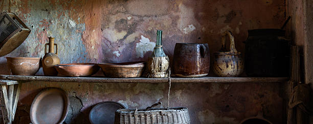 istock Vintage Rustic Kitchen Shelf with Antique Ceramic Pottery and Earthenware Vessels in Abandoned Mediterranean Farmhouse 2244451689