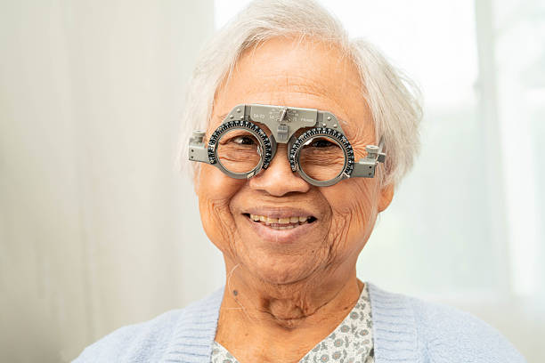 istock Optometrist checking Asian elderly woman ophthalmic vision eye test and using optical trial frame. 2244452123