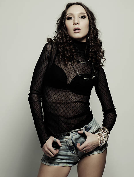 istock fashion model with curly hair 2244452743