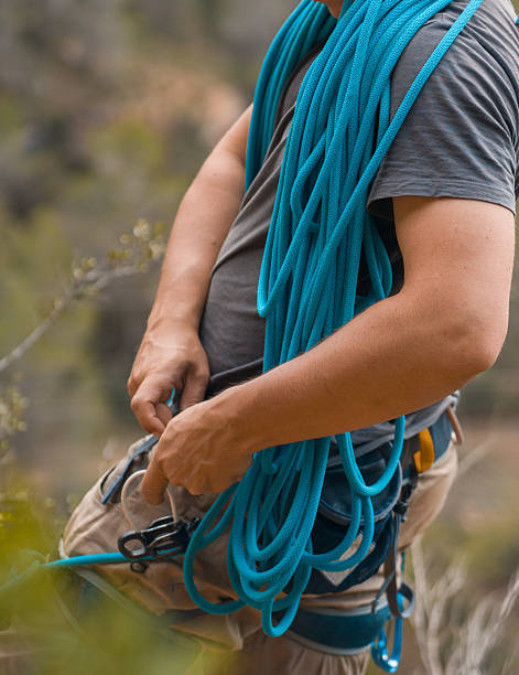 istock Man with a rope climbing in the mountains. Technical mountaineering. 2244452834