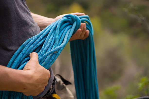 Man with a rope climbing in the mountains. Climbing in the mountains of Spain. Technical mountaineering.
