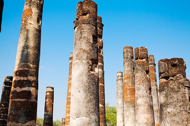 Thai columns in ruins of Sukothai  historical park in mid northern  central Thailand