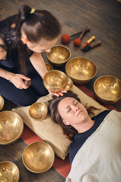 istock Harmony and healing with singing bowls in calming environment 2244459280