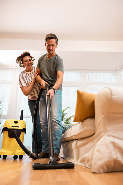 istock Couple Cleaning Home 2244460738