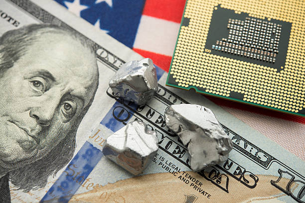 Close up rare earth element on US dollar banknote, American flag and CPU computer. US vs China chip war, tech war, semiconductor industry concept. China curbs on exports of rare earth element to US.