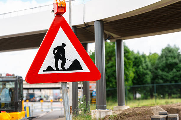 istock Road Work Warning Sign Near Urban Bridge Construction 2244463011