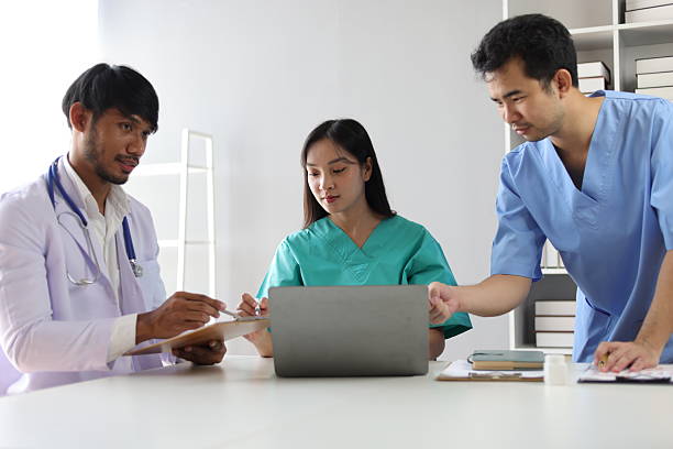 istock Medical team discussing patient data on laptop during meeting, discussing patient data and treatment plans, teamwork and innovation in healthcare. 2244463507