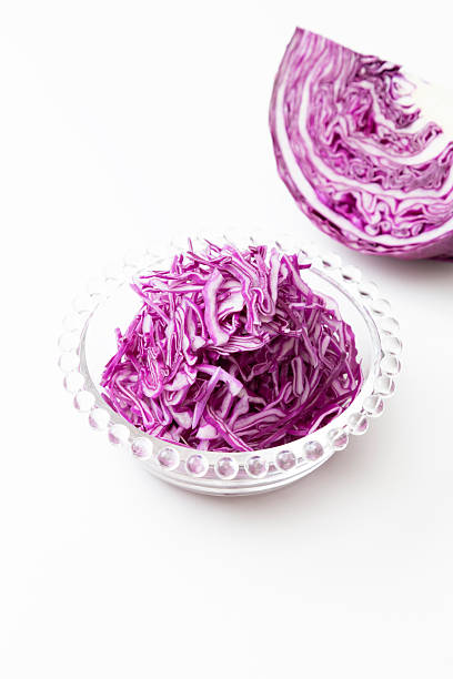 Shredded purple cabbage on a white background