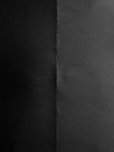 istock High-resolution texture of gray paper or cardboard featuring a clear cross-fold pattern with natural creases and light scratches. 2244465557