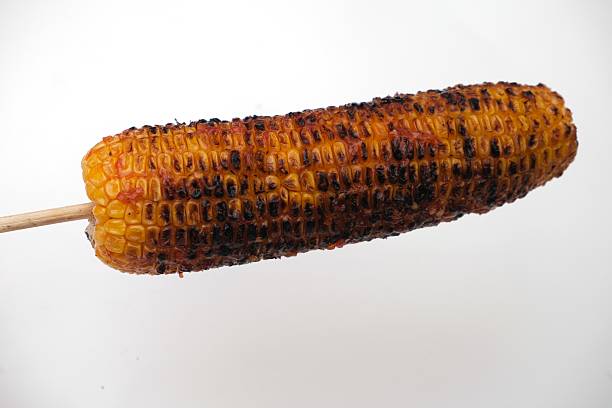 istock Grilled corn on the cob on white background 2244466279