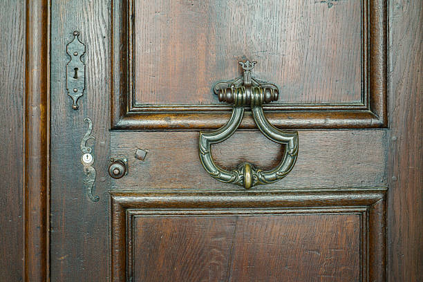 istock An antique wrought iron door handle with decorative patterns, located on a door in Bern, Switzerland The door in the background is painted Brown 2244467868