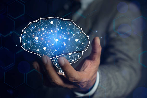 istock Businessman showing his virtual glowing brain on blue bokeh background. AI Technology, thinking. Smart thinking concept 2244469566