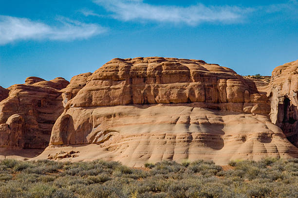 distant view of mountain range with rock windows and arches
