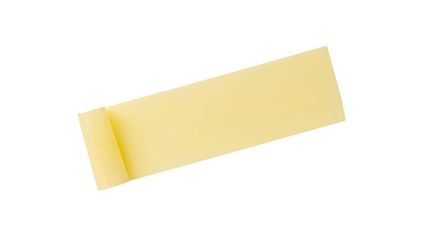 istock Yellow painter's tape isolated on white background, macro. Torn, crumpled, twisted strips of yellow painter's tape on white background 2244470486