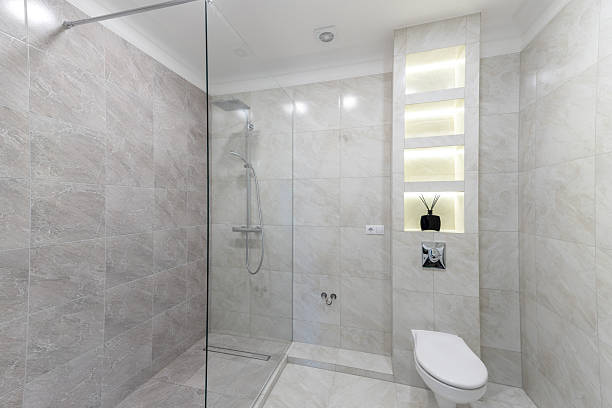 istock Modern Home Bathroom With Elegant Shower and Modern Toiletry Shelving 2244474201