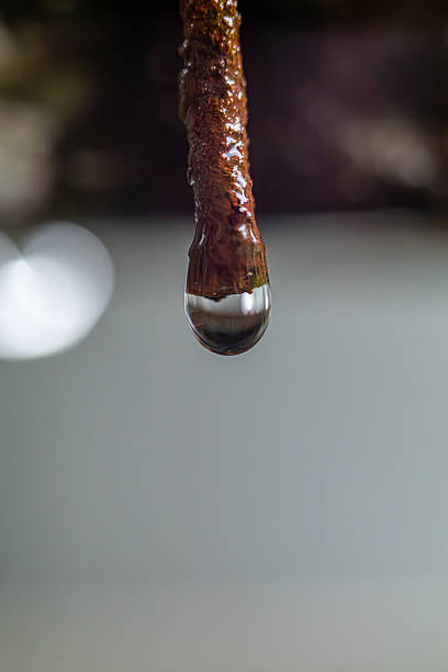istock Macro Close-up of Water Drop on Rusted Metal 2244476720