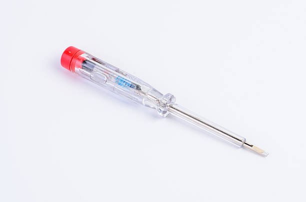 Close-up of a transparent indicator screwdriver on a clean white background, showing metal tip, handle, and internal components. Perfect for tools, repair, and DIY concepts.