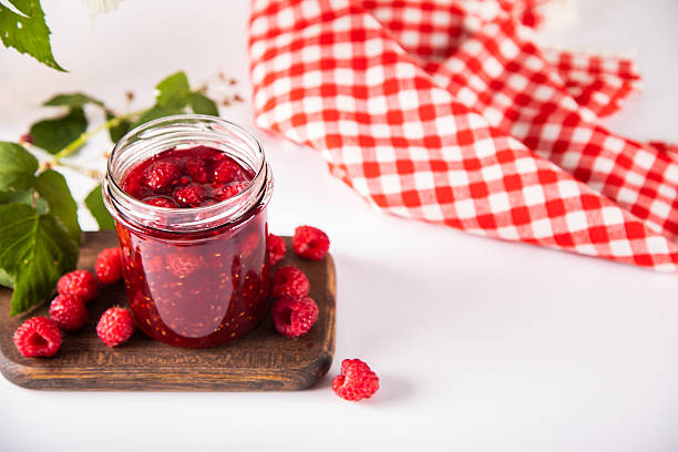 Homemade raspberry jam with fresh berries