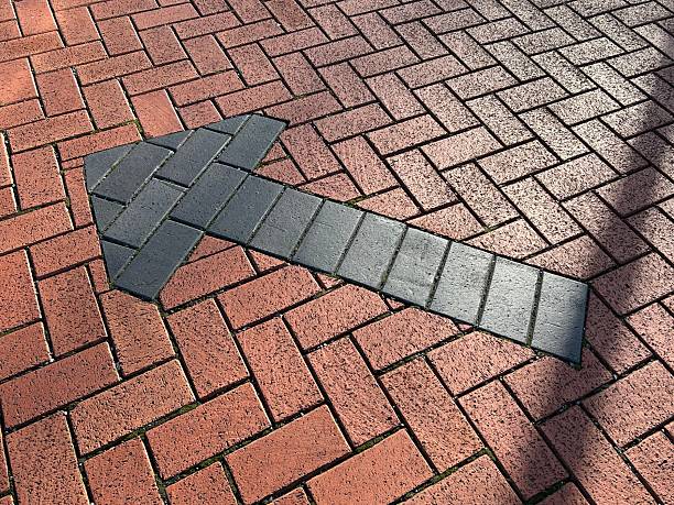 Arrow Shaped Brick Pathway On Red Paver Ground