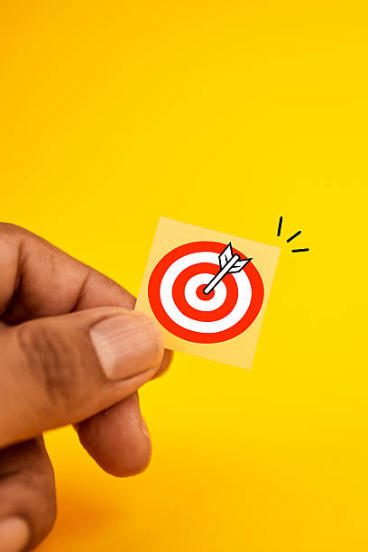 istock Hand showing a bullseye with an arrow, illustrating clear objectives, accurate execution and goal achievement. 2244493270