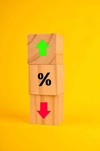 istock Stacked blocks with arrow up, percent symbol and arrow down, depicting interest rate dynamics, risk and financial trends. 2244493466