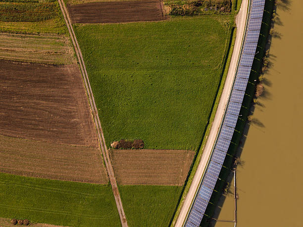 istock Green Energy Landscape with Solar and Hydro Power on River, Sustainable Modernization 2244494323