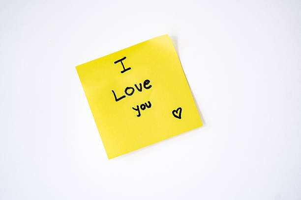 istock Sticky note with ‘I love you’ written on it and a white background 2244495887