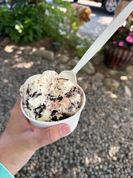 istock Hand holding a cup of ice cream 2244497162