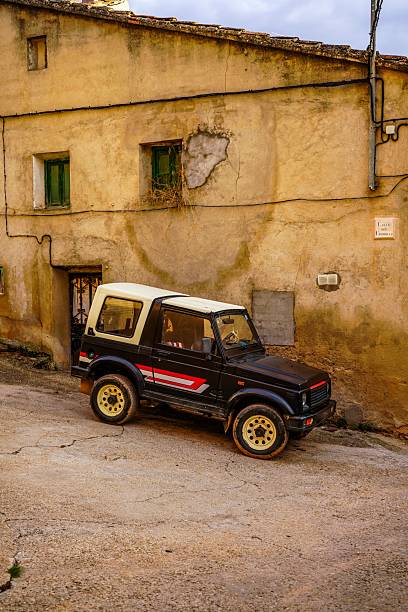 istock Old 4x4 parked on a village street. 2244498565