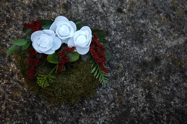 Small wreath placed on grave site, close-up, Copy Space. Tribute and remembrance scene.