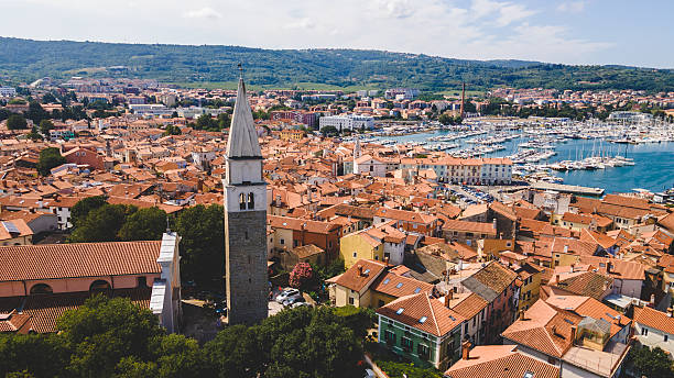 istock Church tower above seaside town aerial view 2244504577