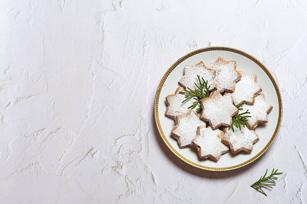 Lovely Plate of Frosted Star Cookies with a Touch of Greenery