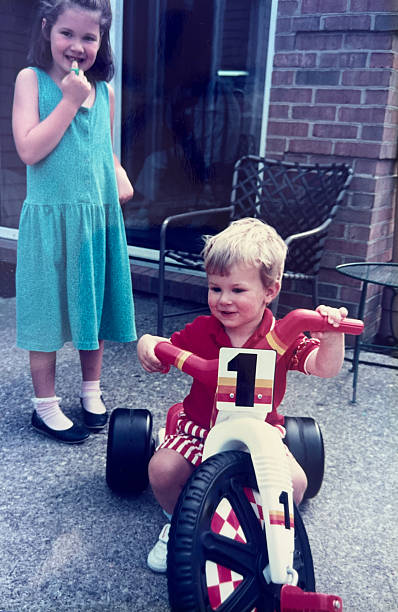 istock Siblings and Tricycle 1980s 2244507814