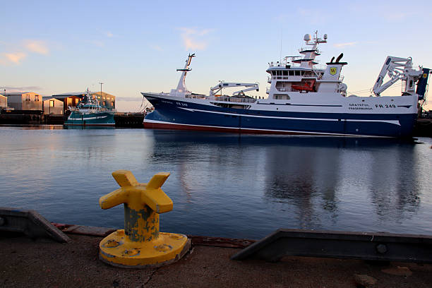 Fraserburgh, Aberdeenshire, Scotland - November 1, 2025:  Trawlers  moored in Fraserburgh harbour at dusk